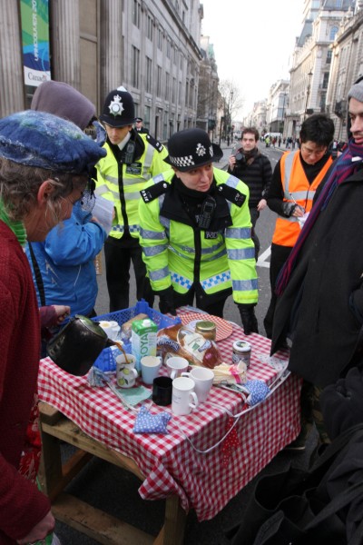 Tar sands protestors tea party in the road outside Canada House, London