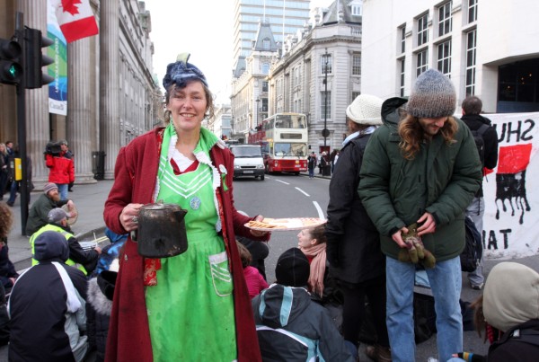 Tar sands protestors tea party in the road outside Canada House, London