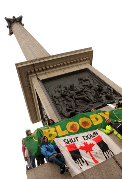 Tar sands protestors unfurl banners on Nelson's Column, Trafalgar Square, London