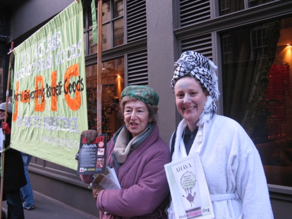 Protesters in bathrobs; Jews for Boycotting Isreali Goods banner