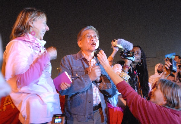 Medea Benjamin and Walden Bello speaking in front of El-Mogamma