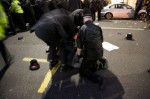 A demonstrator beaten by the police