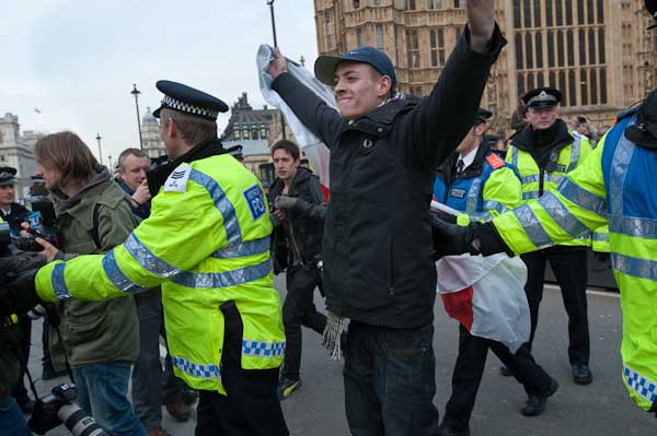 Police escort EDL man back to pen