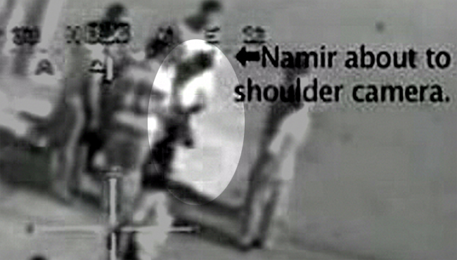 Namir looking at his work.