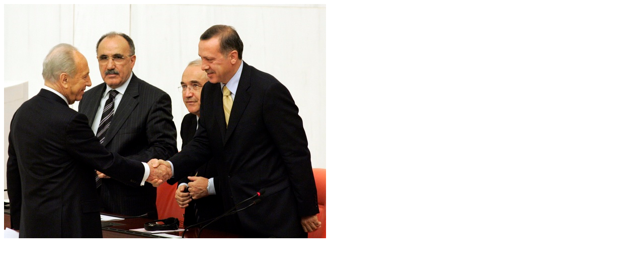 After giving a speech in Turkey's parliament, Peres shakes Erdogan's hand, 2007