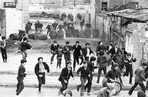 A skirmish between Irish youth fighting with stones and British paratroopers