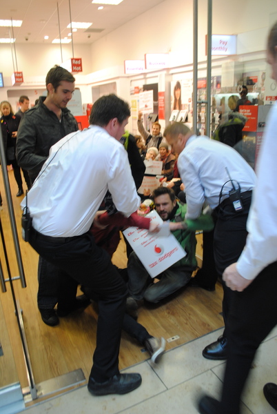 Protesters are dragged out of the store