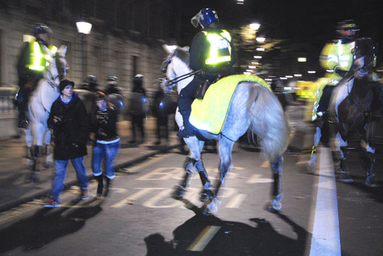 Police Horses Push Crowd Back