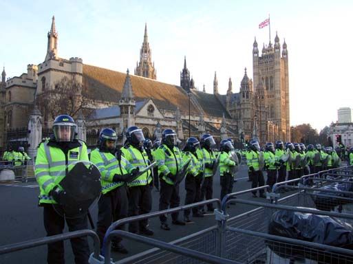 Defensive line of police, deployed in front of Westminster Hall.