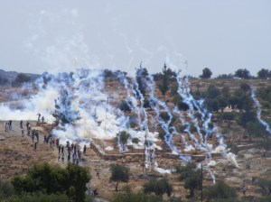 Tear gas shot from a vehicle mounted launcher in Bil In