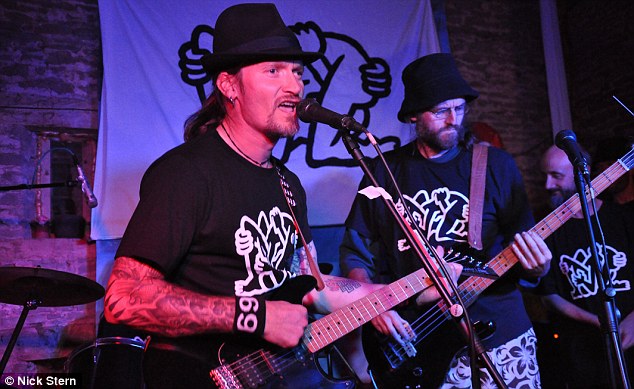 Mark Kennedy playing guitar