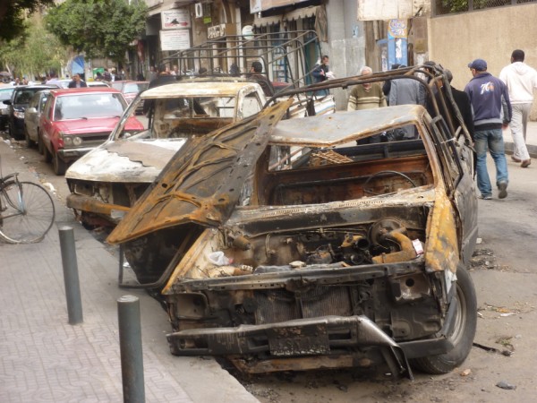 Burned out cars near government buildings on Falaky street