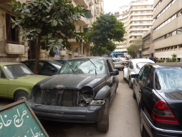 Burnt out cars near government buildings