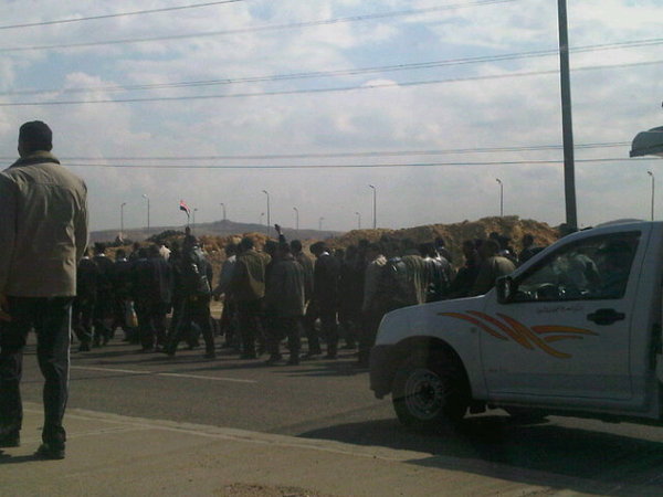 300 policemen protesting with flags in October City