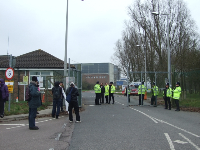 protesters arrive to find the main gate blocked by cops and YW managers
