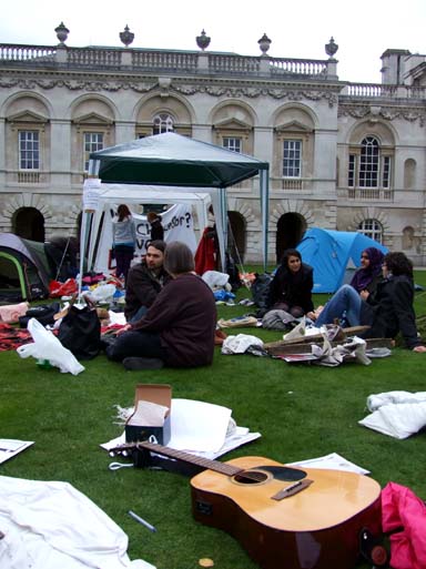 Pitching tents on the lawn, but it's no picnic.