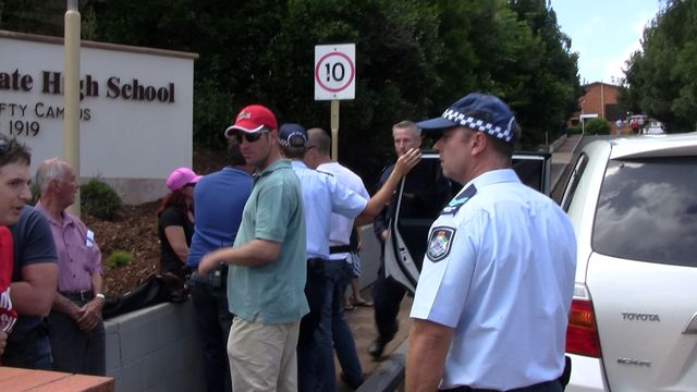 Detective Adam Hankinson handcuffing my son to the rear