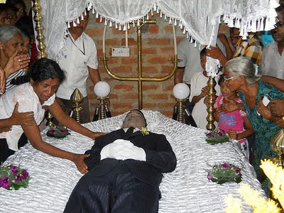 Family and friends mourning the slain Ratnasekera