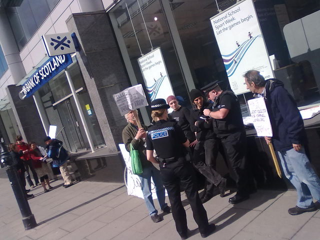 Police arrive and question the protesters