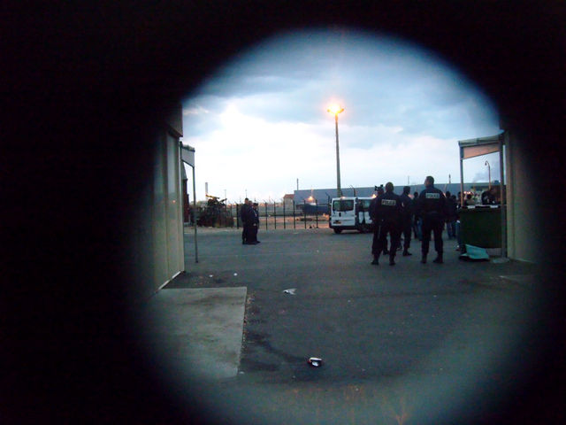 Food distro raid seen through the gate