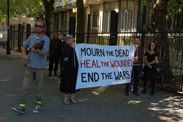 holding the banner to face the square