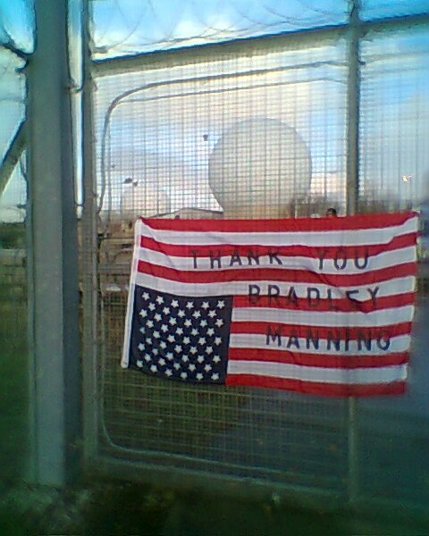 'Thank You Bradley Manning' flag on the perimeter fence at NSA Menwith Hill