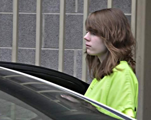 Convicted killer 18-year-old Alyssa Bustamante is lead away to a police car.