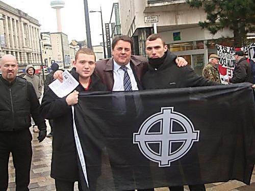 Nick Griffin with Nazi flag waver
