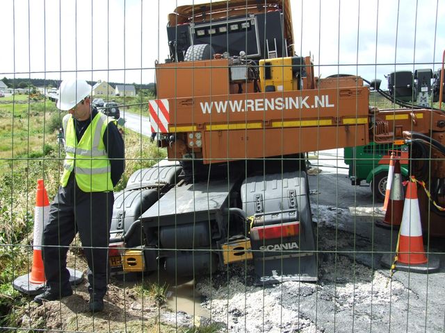 Truck in ditch as road gives away under weight