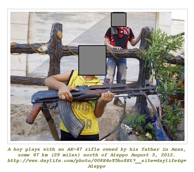Boy plays with AK-47