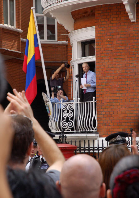 Supporters applaud Julian as he appears on balcony