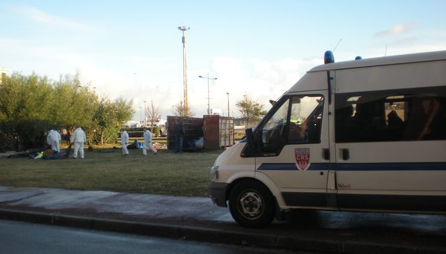 Riot&border police chaperone council workers putting people's stuff in the dump