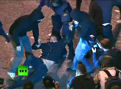 Two hoodies + riot cop arrest protestor in Madrid