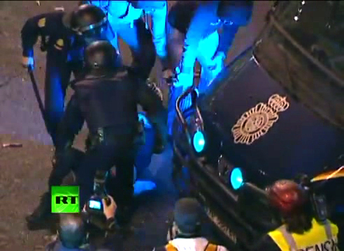 The same 2 hoodies (top of photo, in blue light) + riot cops finalizing arrest