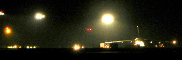 Convoy parked next to C17 plane