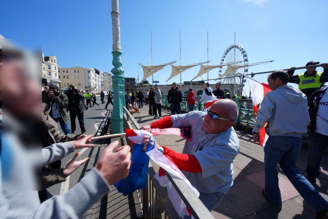 fash scum has flag ripped away