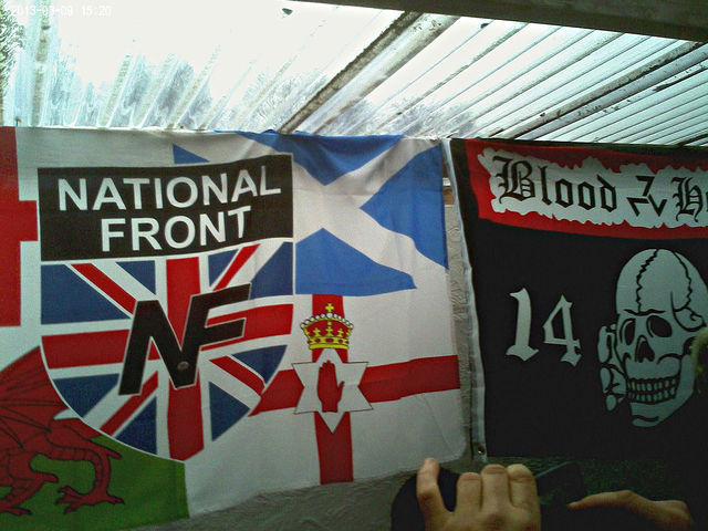 Close-up of NF and Blood & Honour flags at Swansea NF "White Pride" event