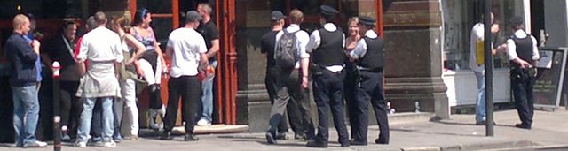 A dozen EDL outside pub (man with backpack is random passer by) 6/6/13