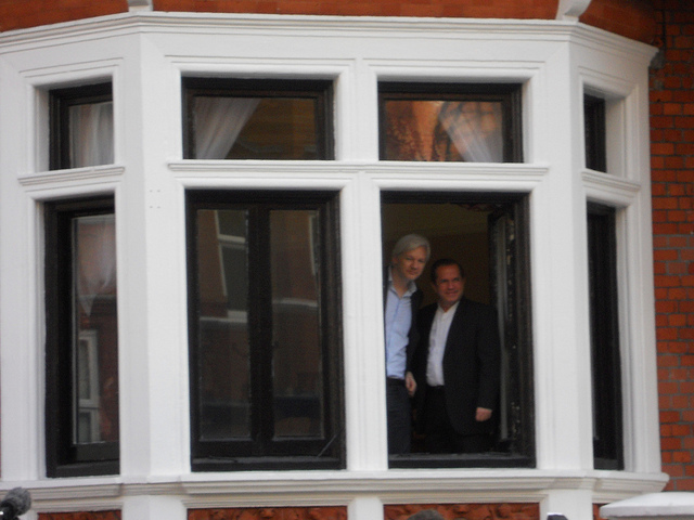 Julian Assange and Ricardo Patino appear at Embassy window