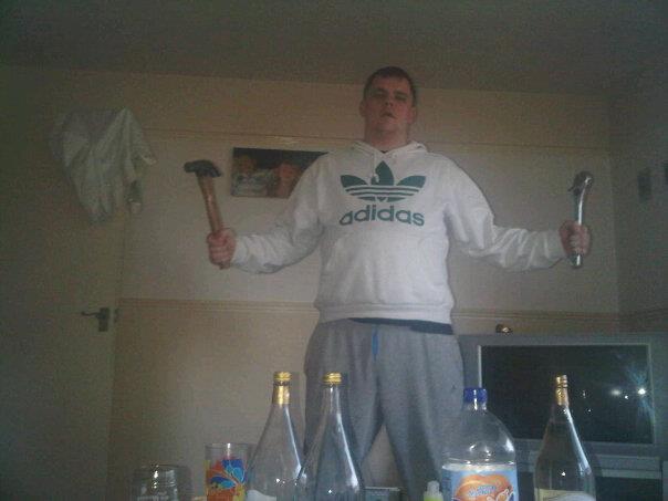 Nicky 'Slash' Lee wielding two hammers