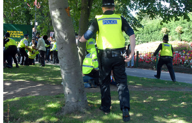 EDL member arrested, notice the police person to the left also on the floor
