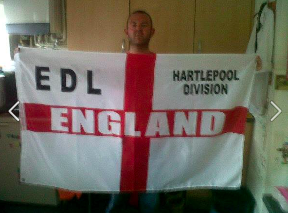 Craig Owens with EDL flag