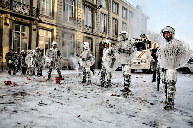 Belgian fire-fighters hose down the police!