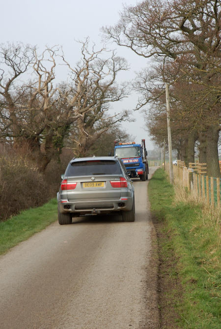 The skip truck eventually reverses