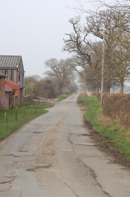 Man in orange (just a dot) halfway down the lane