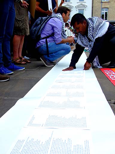 Assembling the names of the dead.