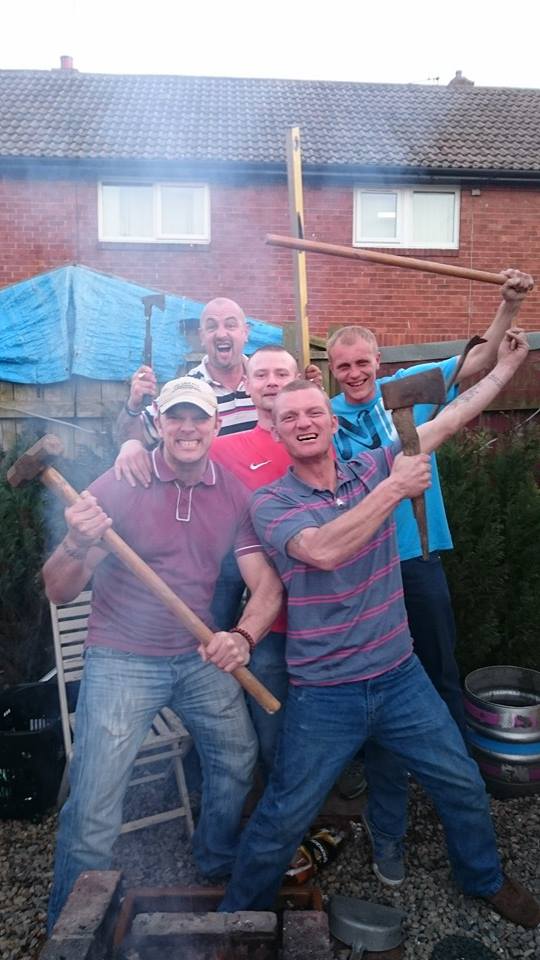 Darren with NEI members brandishing weapons