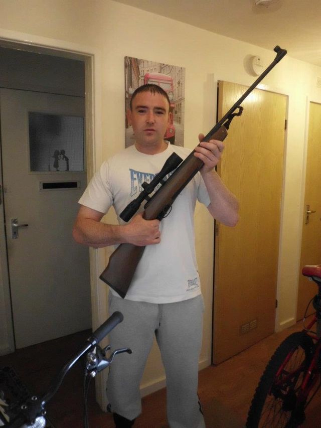 Alfie Harrison with gun