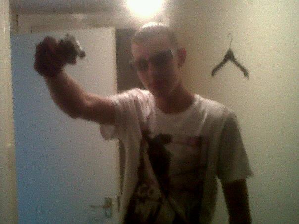 Craig Alan ‘Wilson’ Bell with pistol
