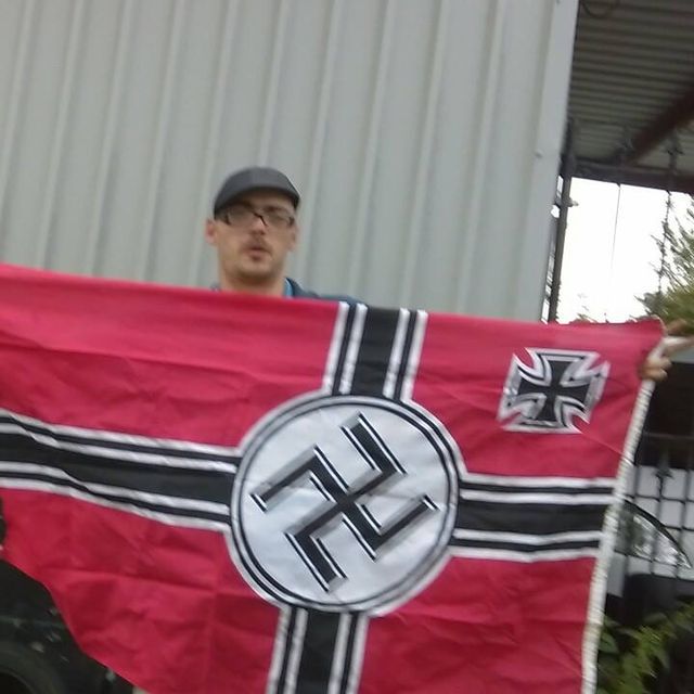 Tony Baker with Swastika flag he can't even display the correct way around